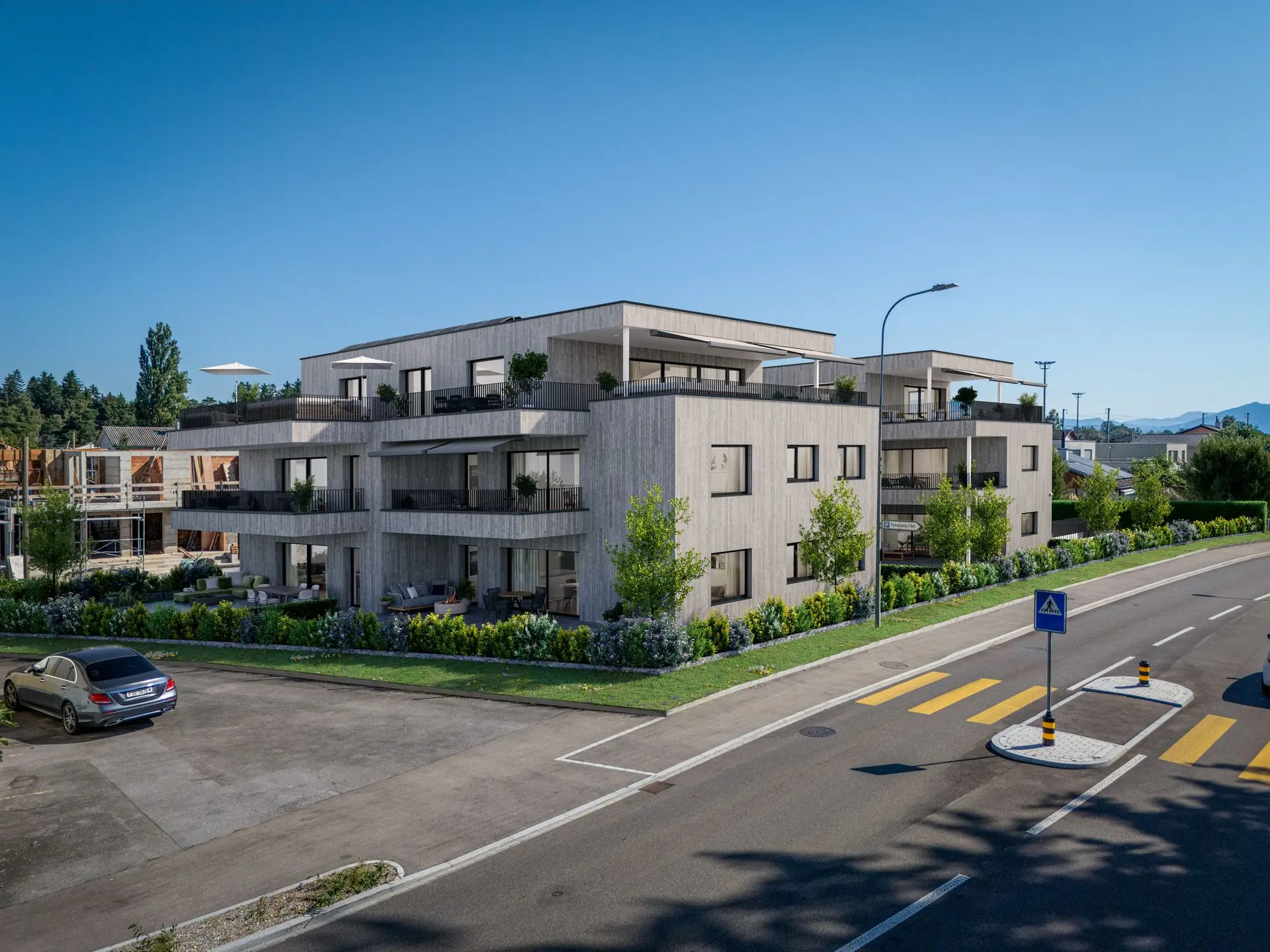 Aussenvisualisierung einer modernen Wohnanlage mit realistischer Umgebung