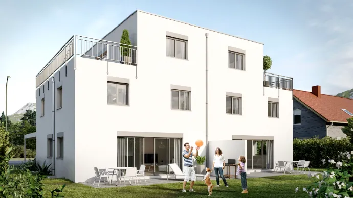 Aussenansicht eines weissen Doppeleinfamilienhauses mit Garten
