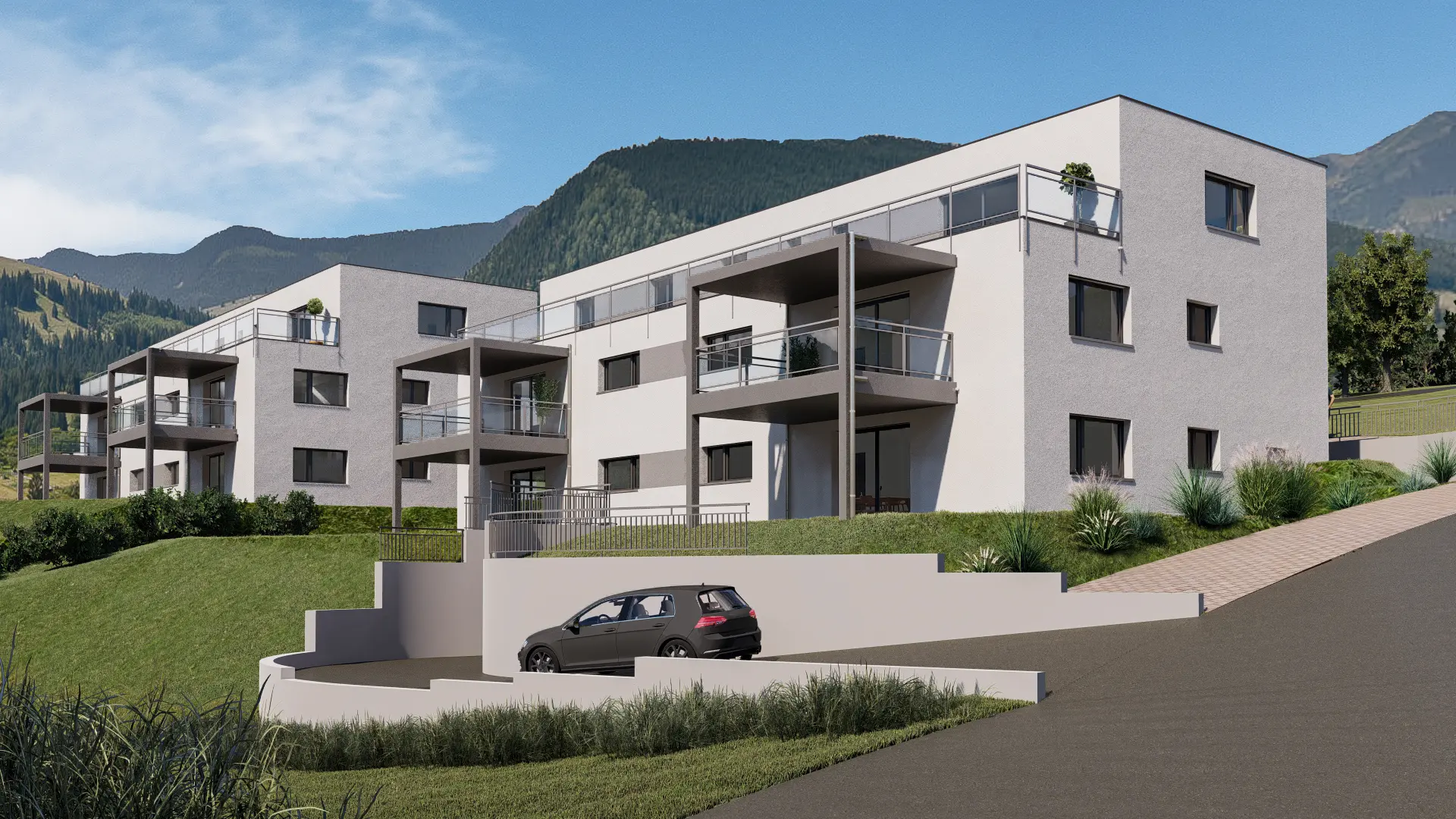 Wohnüberbauung in moderner Architektur mit Balkonen und Tiefgarage, eingebettet in Berglandschaft