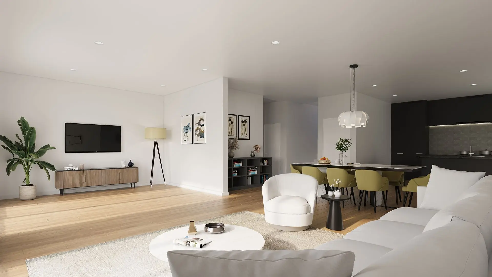 Modernes, offenes Wohn- und Esszimmer mit grauem Ecksofa, rundem Couchtisch, grünem Essbereich für sechs Personen und Küche mit dunklen Fronten.
